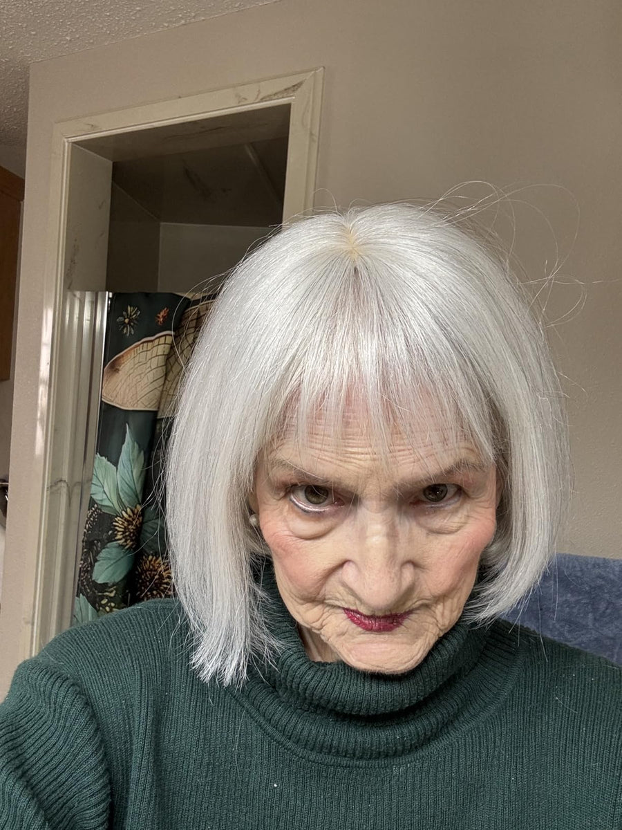 Customer wearing silver white human hair topper with bangs